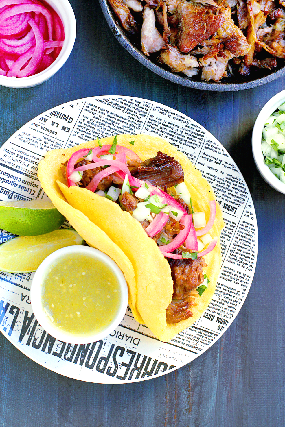 Image of slow-roasted carnitas with salsa verde taco.