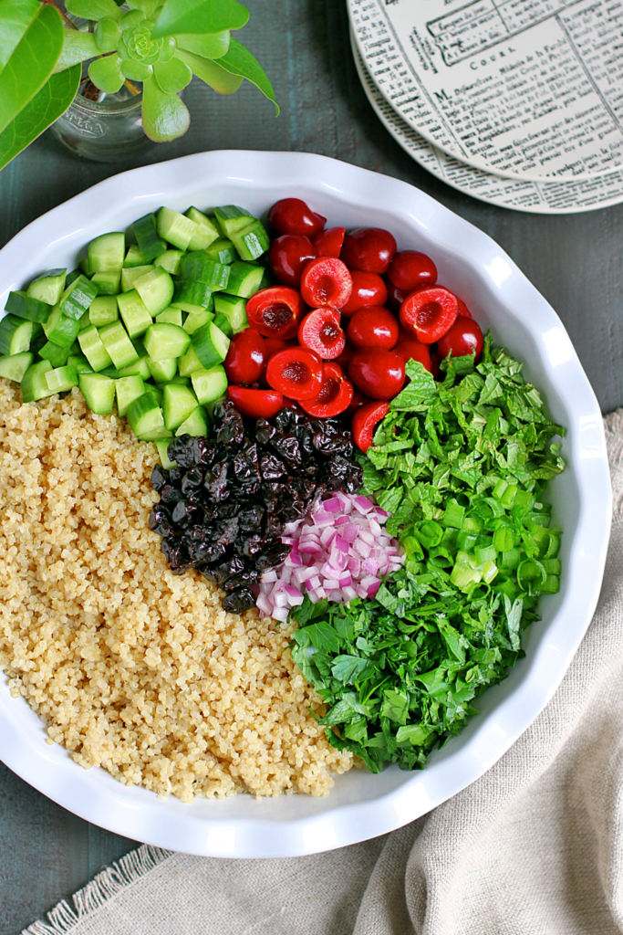 Image of ingredients for quinoa tabbouleh with cherries.
