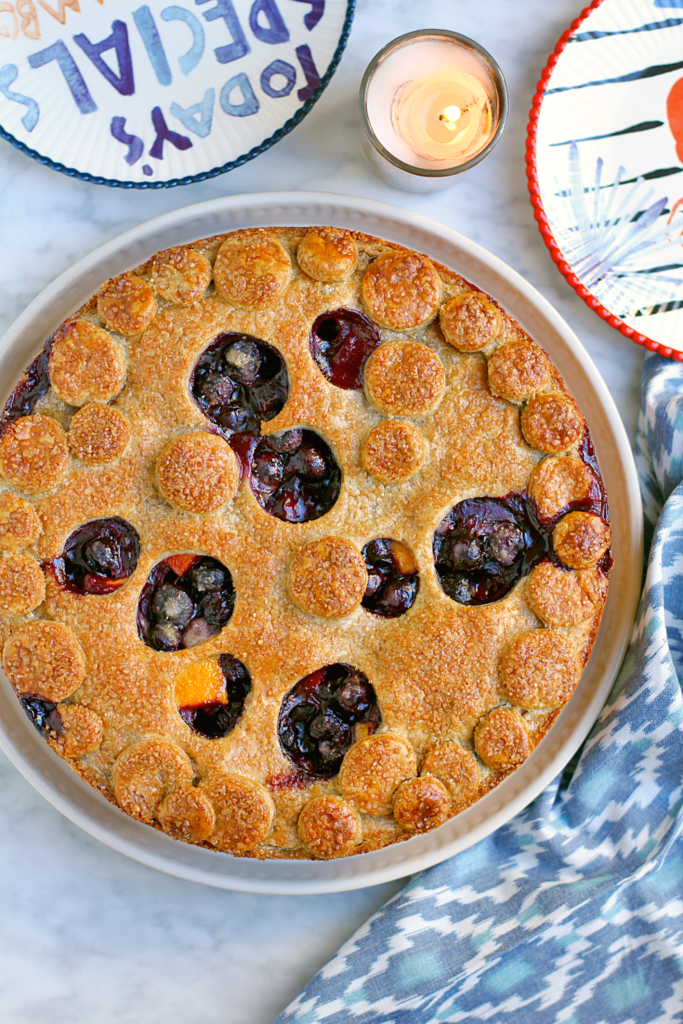 Image of peach and blueberry pie with a rye crust.