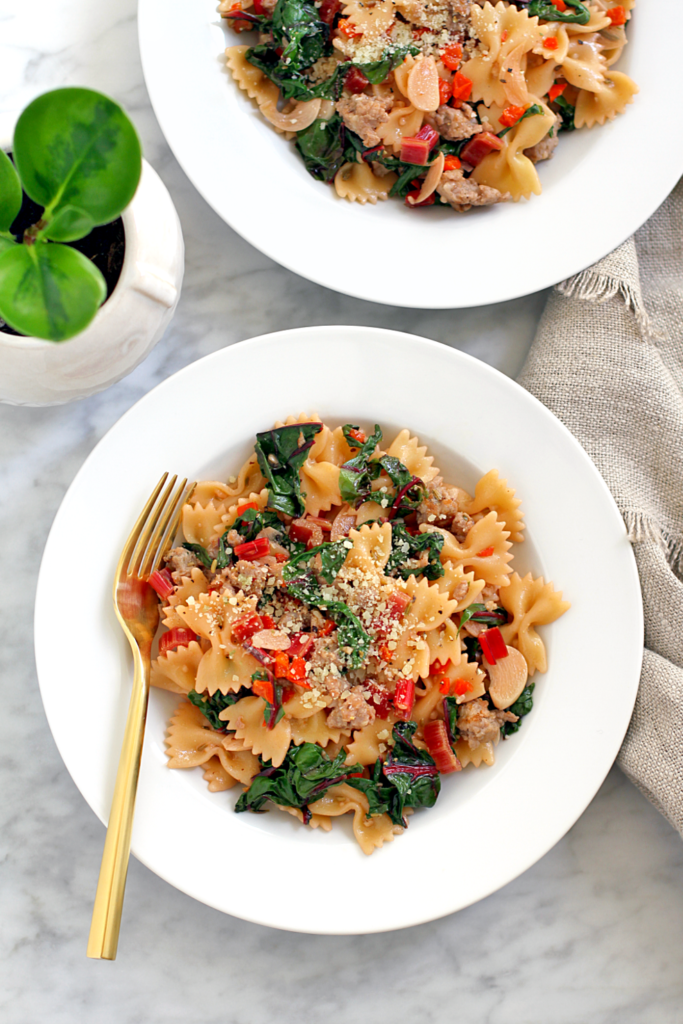 Image of farfalle with sausage and chard.