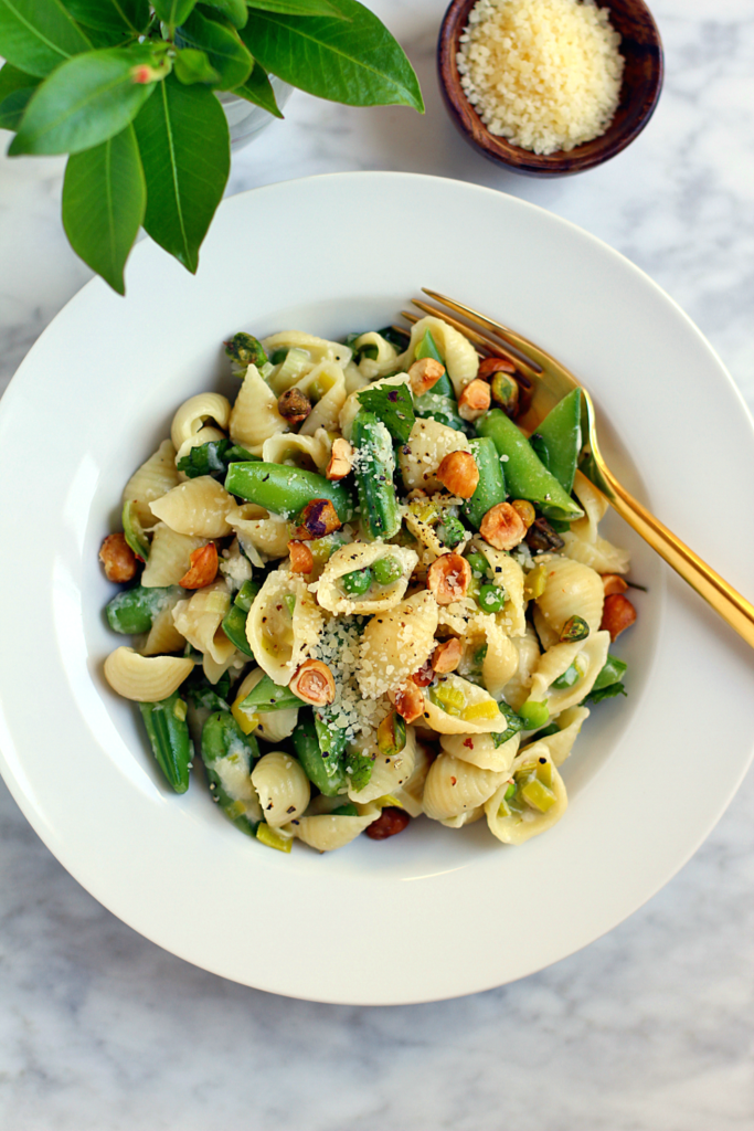 Close-up image of pasta with buttermilk, mint and peas.