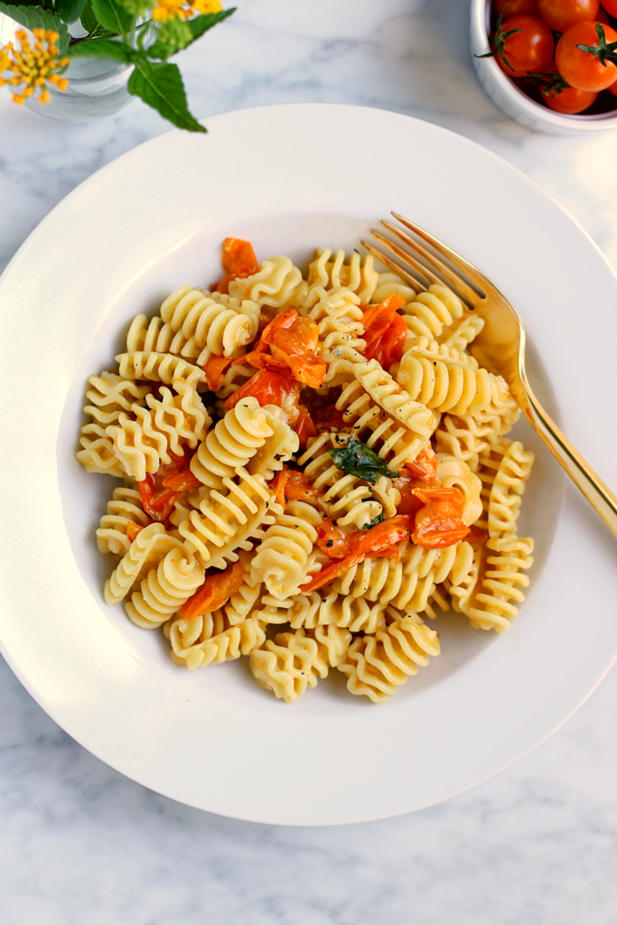 Close-up image of Sungold tomato pasta.