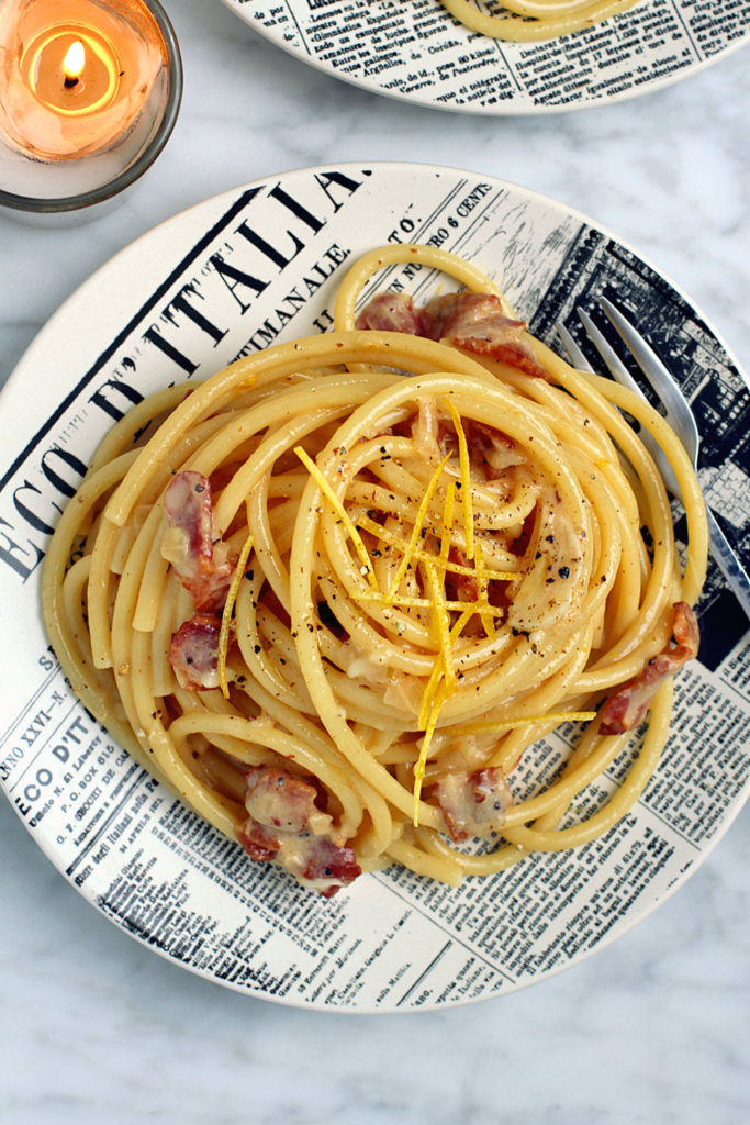 Close-up image of bucatini with lemony carbonara.