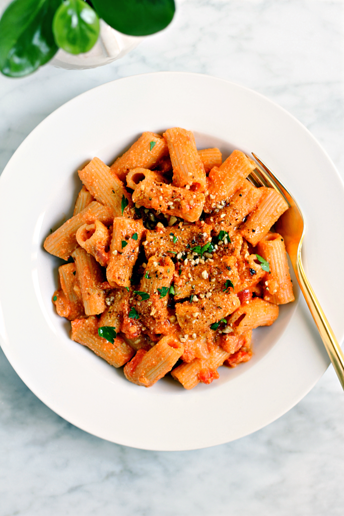 Close-up image of rigatoni with vegan tomato cream sauce.