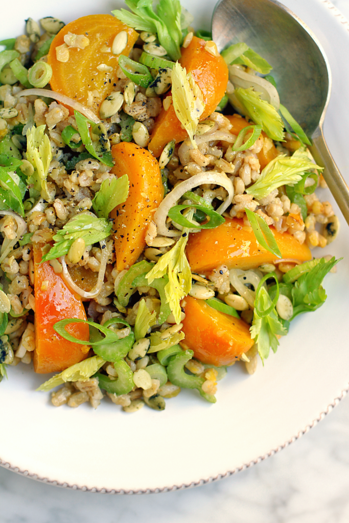 Close-up image of golden beet and barley salad with pumpkin seed vinaigrette.