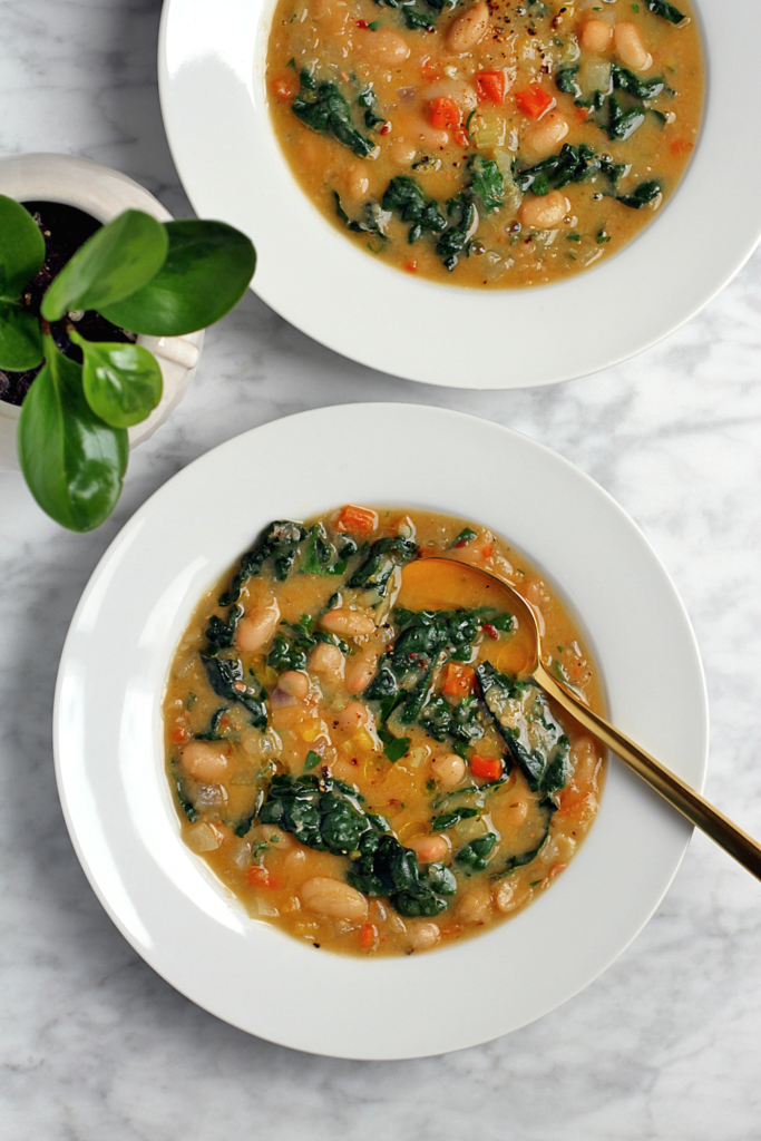 Image of creamy white bean soup with kale.