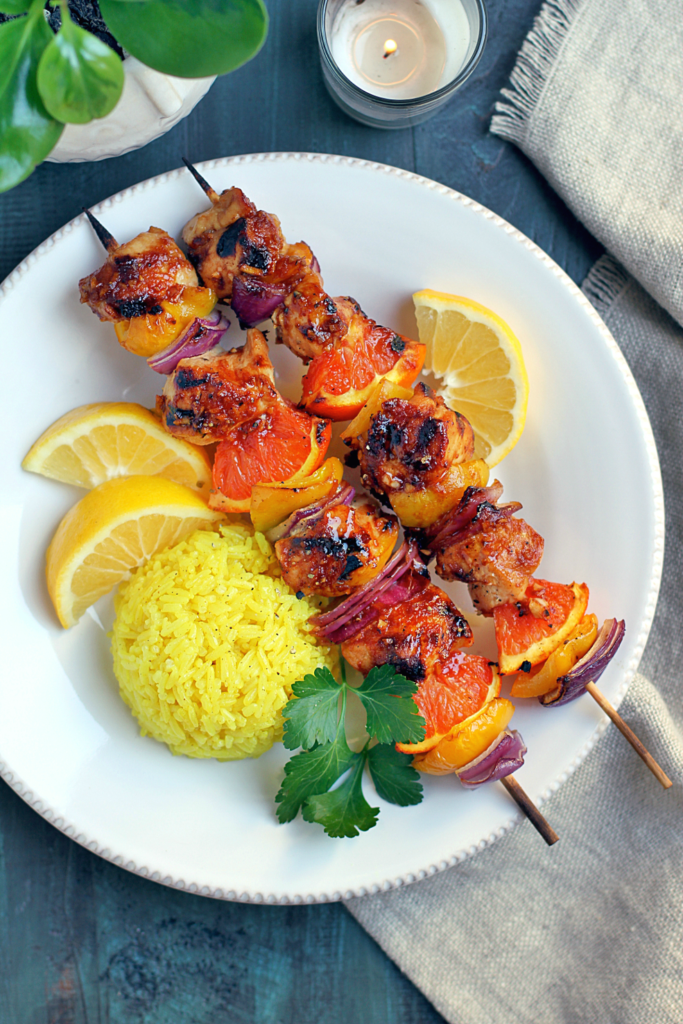 Close-up image of Hawaiian chicken kebabs with turmeric coconut rice.