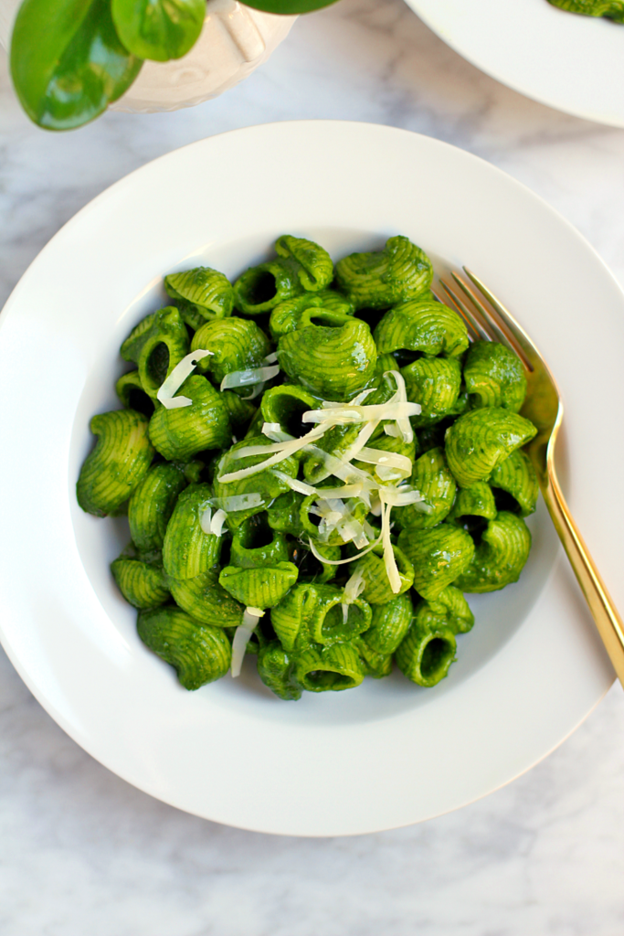 Close-up image of pasta with kale sauce.