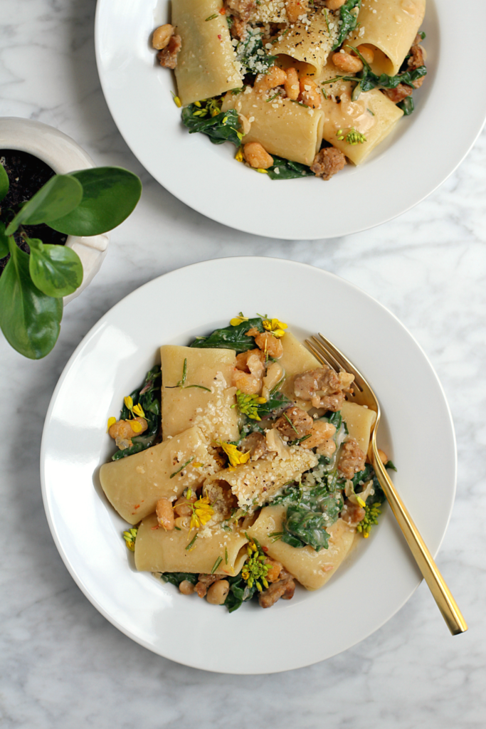 Image of sausage, greens and beans pasta.