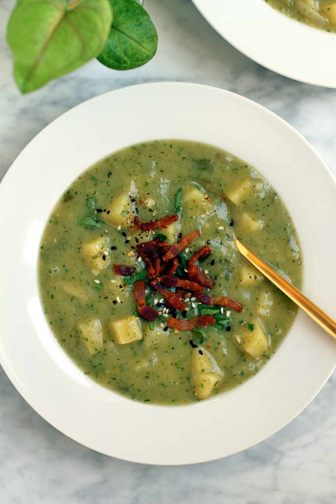 Close-up image of creamy potato, leek and celery soup.