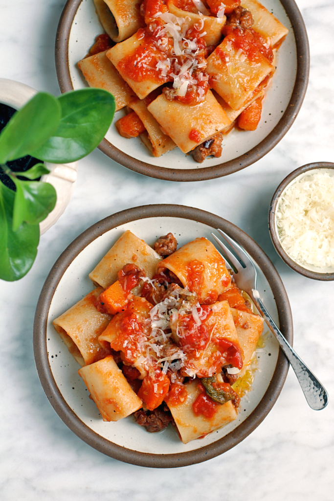 Image of pasta with butternut squash and sausage ragù.