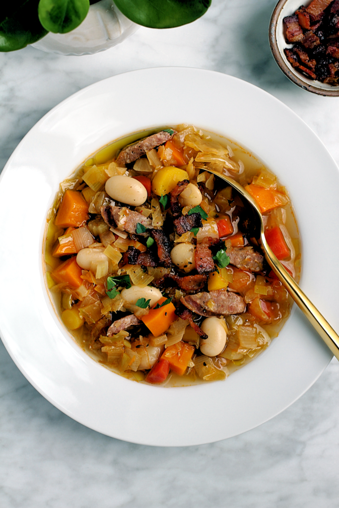 Close-up image of kielbasa and sauerkraut soup.