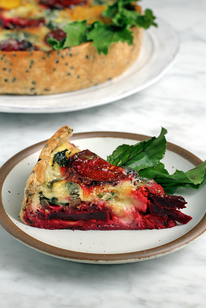 Image of a slice of roasted beet quiche.