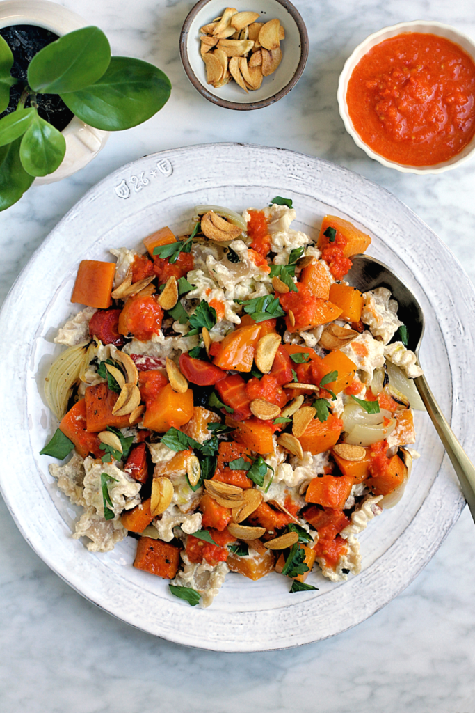 Image of pasta with roasted butternut squash and carrots in warm yogurt sauce.