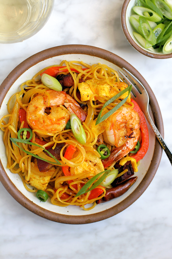 Close-up image of Singapore noodles.