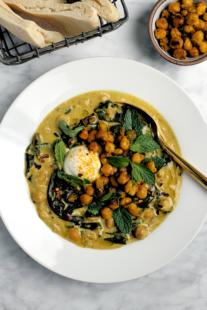 Close-up image of spiced chickpea stew with coconut and turmeric.