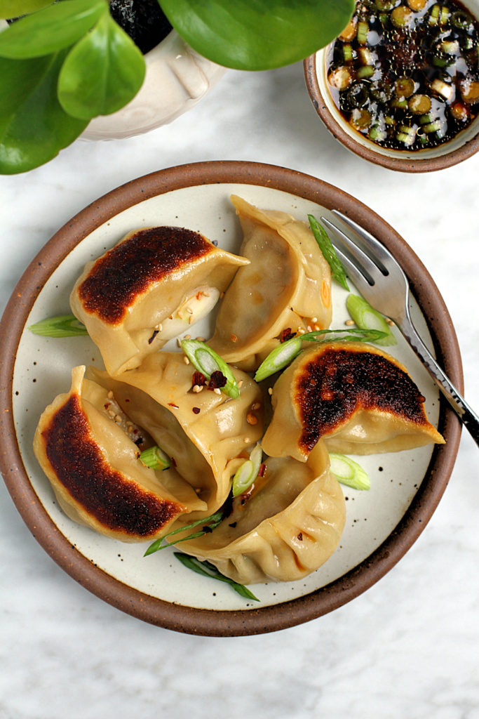 Close-up image of pork and cabbage potstickers.