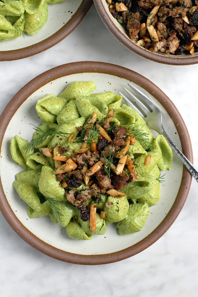 Close-up image of spiced lamb and dill yogurt pasta.