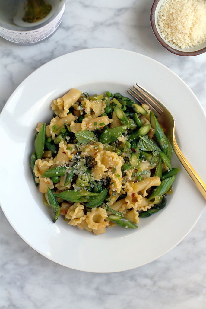 Close-up image of spring vegetable pasta.