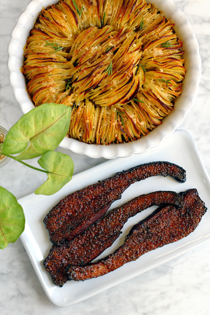 Image of rosemary garlic hasselback potatoes and millionaire's bacon.