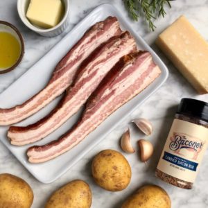 Image of ingredients for rosemary garlic hasselback potatoes and millionaire's bacon.