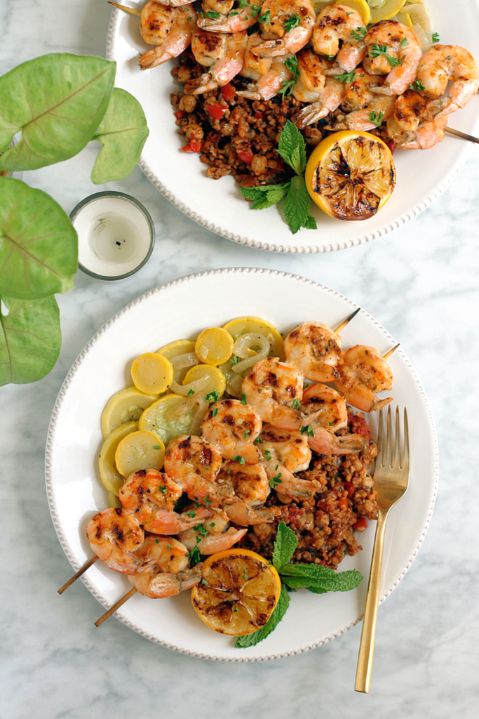 Image of grilled shrimp skewers with Turkish bulgur pilaf.