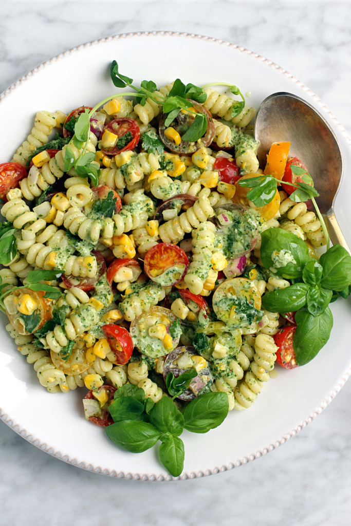 Close-up image of summer pasta salad with creamy cilantro dressing.