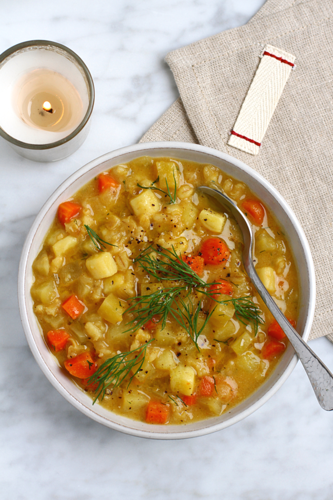 Close-up image of root vegetable and barley stew.