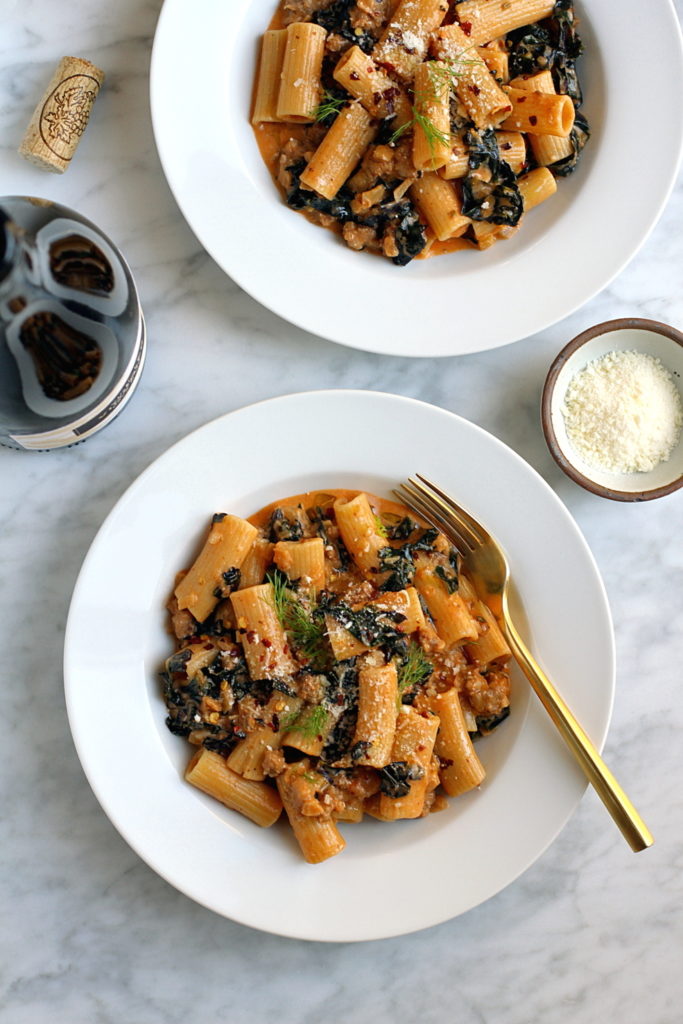 Image of rigatoni with sausage and red kale.