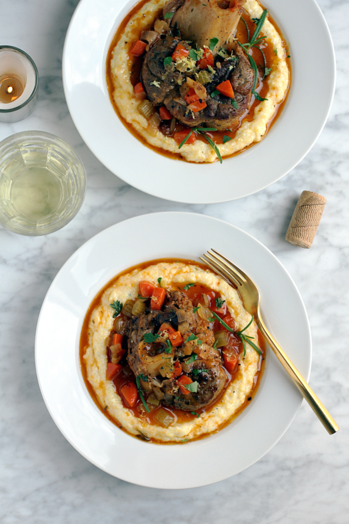 Image of pork osso buco with creamy polenta.