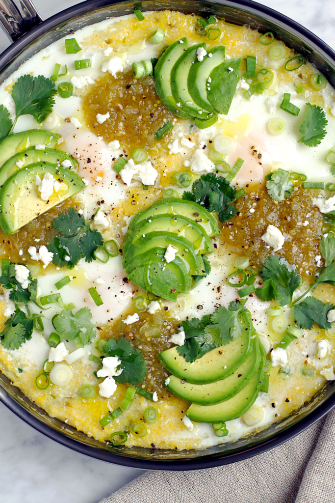 Close-up image of green chile polenta with eggs.