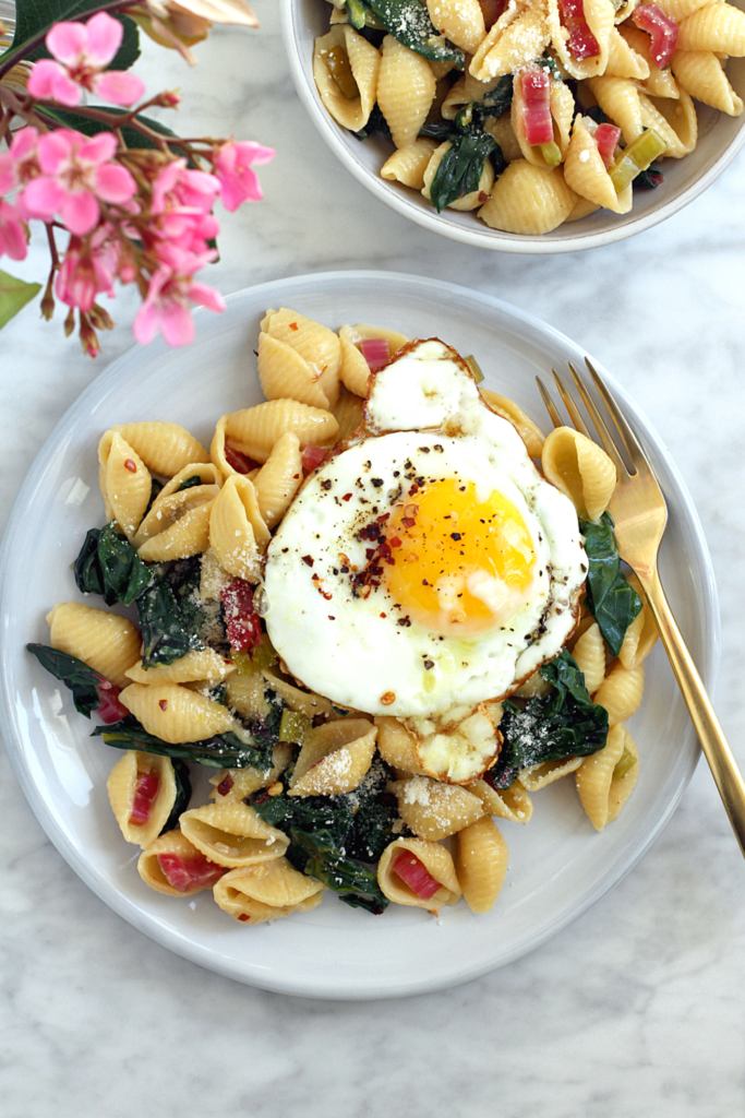 Image of lemony pasta with rainbow chard and Parmesan cheese.