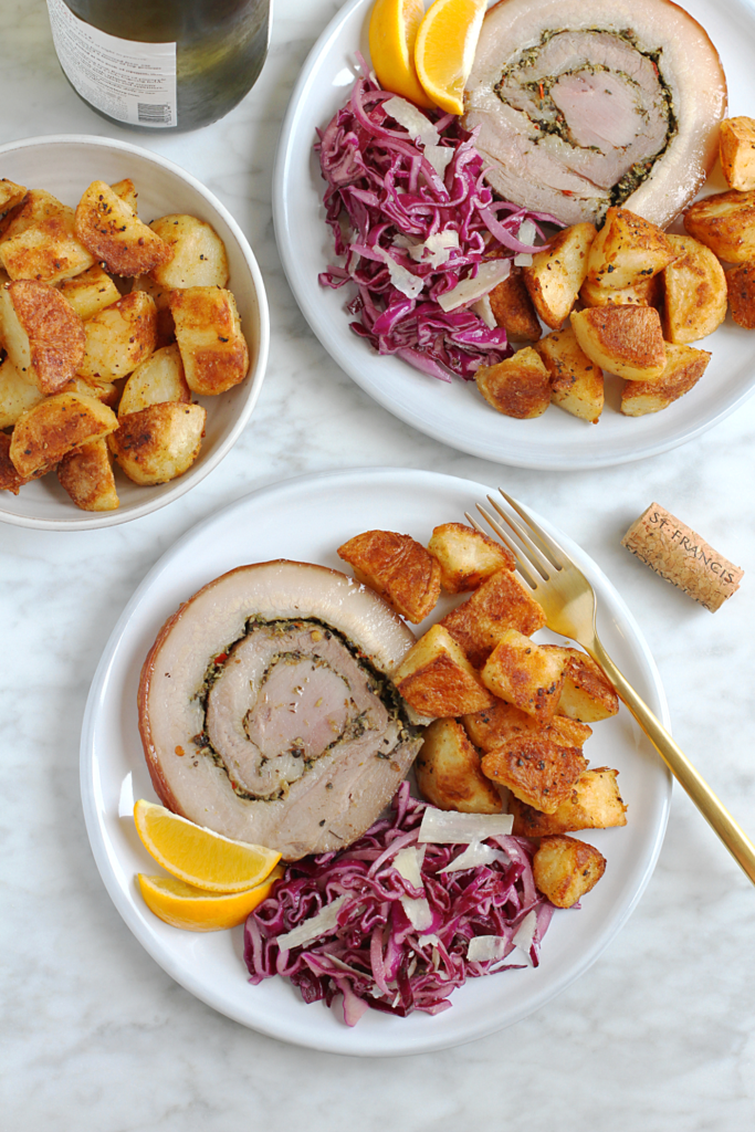 Image of crispy roasted potatoes with porchetta.