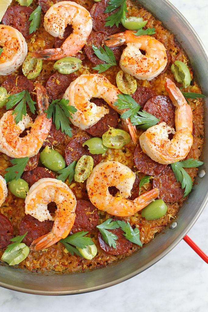 Close-up image of chorizo and shrimp paella.