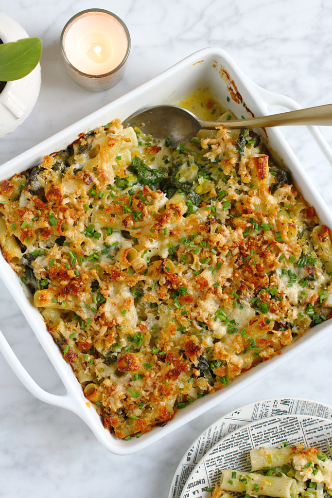 Image of baked pasta with cheddar and broccoli rabe from the top.