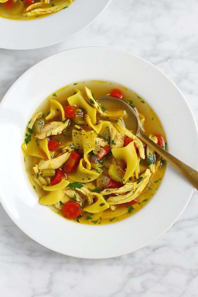 Close-up image of chicken noodle soup with homemade broth.