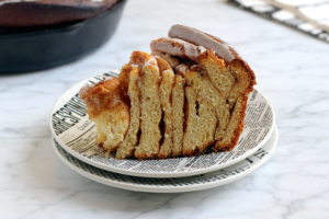 Image of a slice of giant cinnamon roll.