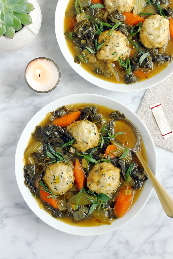 Image of vegan winter greens stew with herb dumplings.