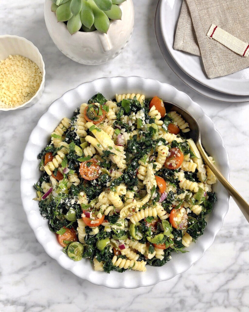 Image of kale pasta salad with grilled green onion vinaigrette.