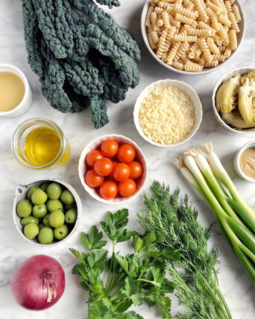 Image of ingredients for kale pasta salad with grilled green onion vinaigrette.