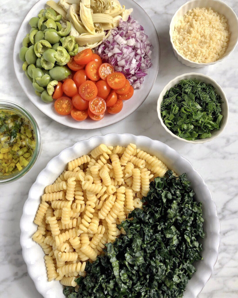 Image of prep for kale pasta salad with grilled green onion vinaigrette.