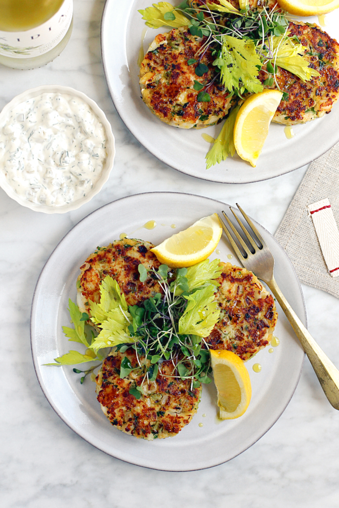 Image of cod cakes with tartar sauce.