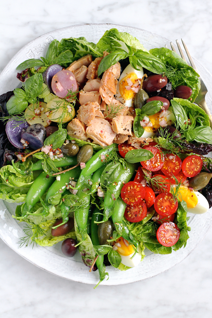 Close-up image of smoked albacore tuna Niçoise salad.