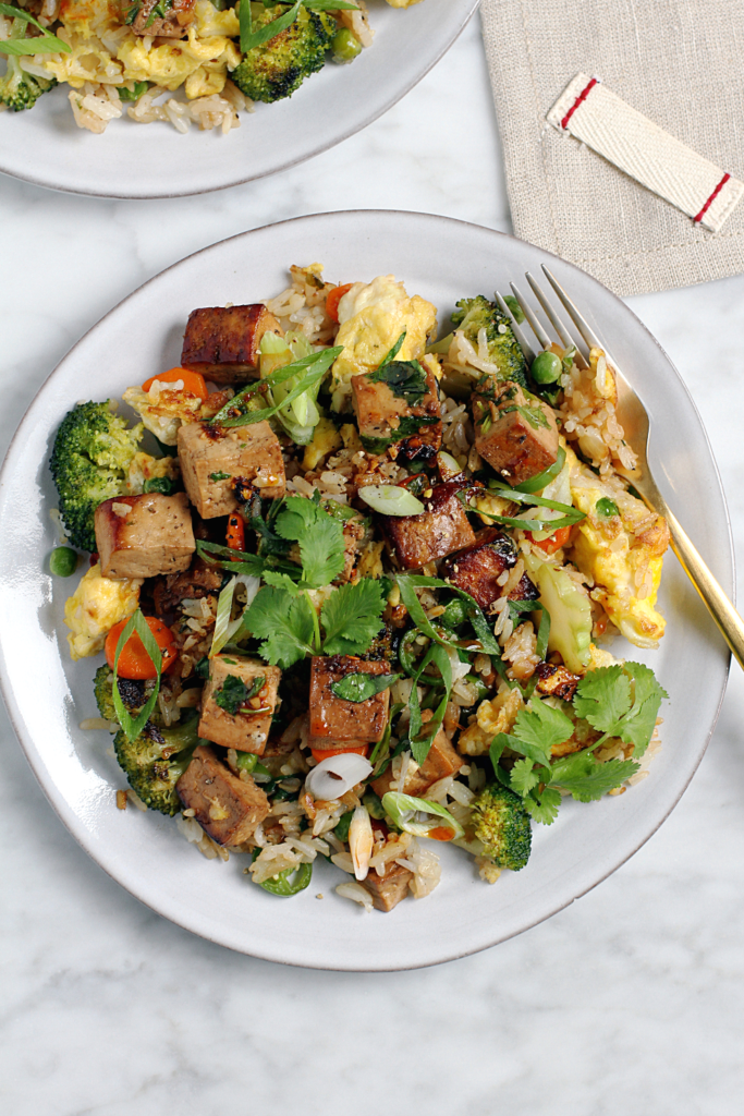 Close-up image of tofu and broccoli fried rice.